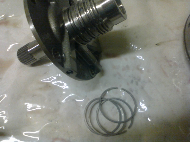 These four new steel rings must go into the grooves on the stator support. Earlier 41TEs had only three, and updating to the 4-ring design is HIGHLY recommended when rebuilding an older unit.